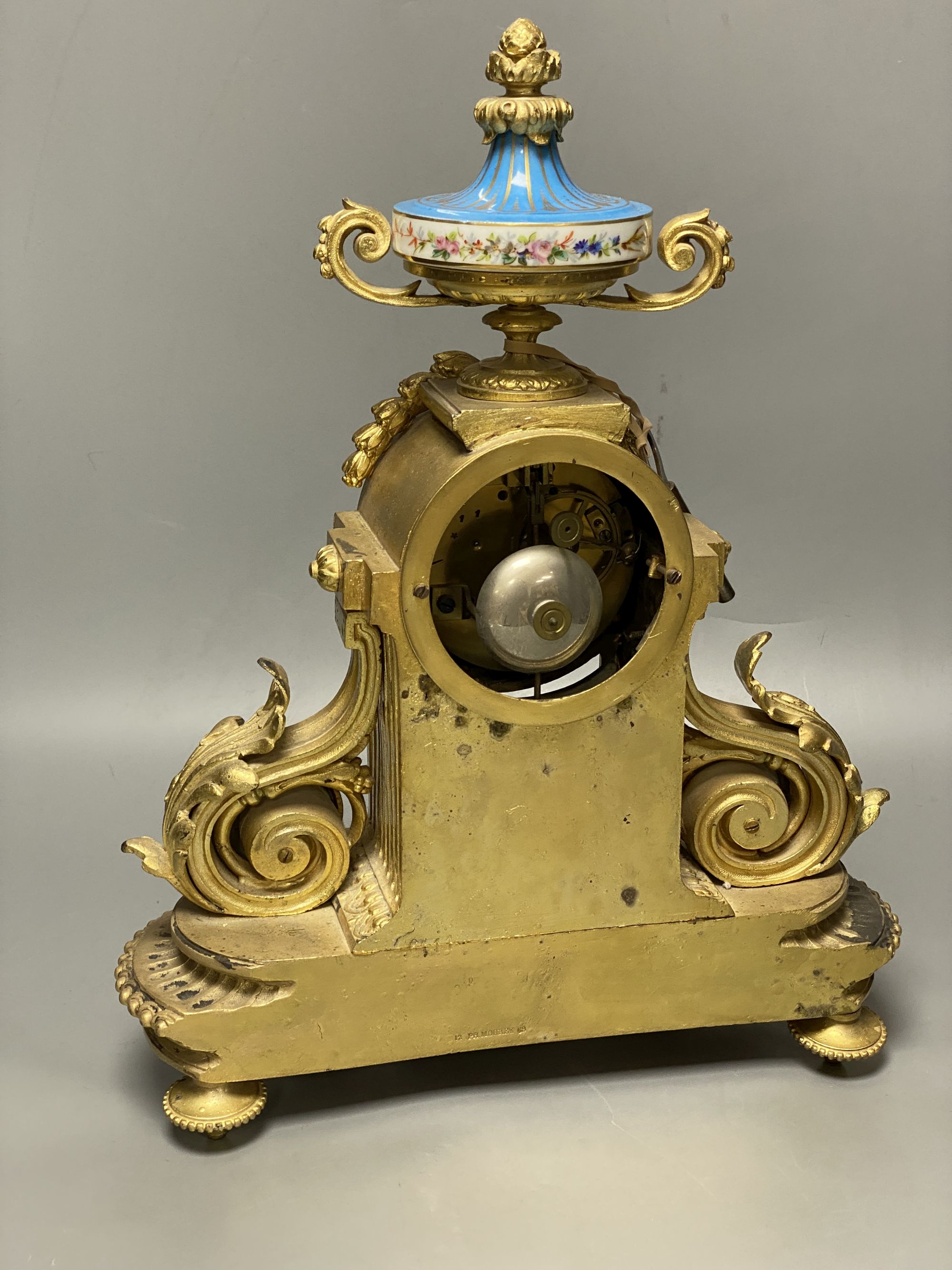 A Louis XVI style gilt spelter mantel clock inset Sevres style panels, height 38cm